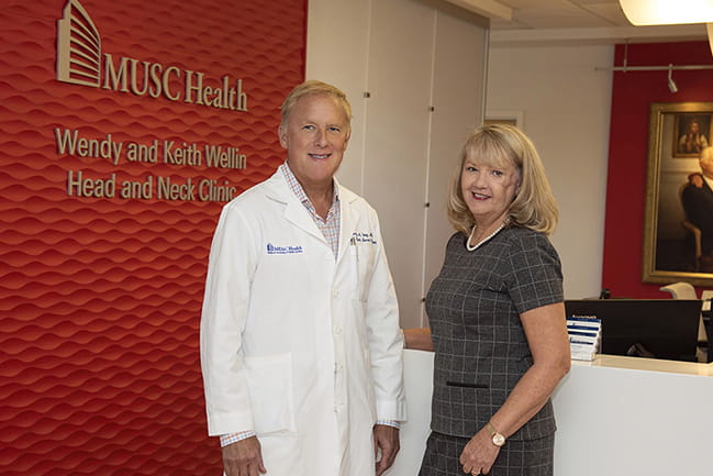 Head and neck cancer specialist Dr. Terry Day stands with Robin Rutkowski in the Wendy and Keith Wellin Head and Neck Clinic at MUSC Health after a tour. Photo by Anne Thompson