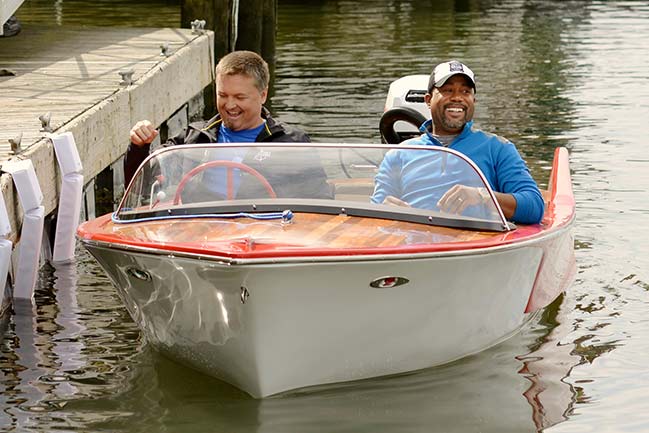 Edwin McCain and Darius Rucker in the restored boat, Harmony