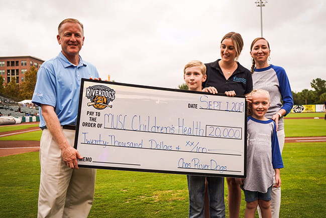 RiverDogs President/GM Dave Echols, Children’s Miracle Network Champion David Powell, Haley Kirchner, Sarahann Powell, and Della Powell.