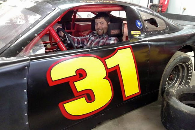 Hunter sits in a Charger division race car