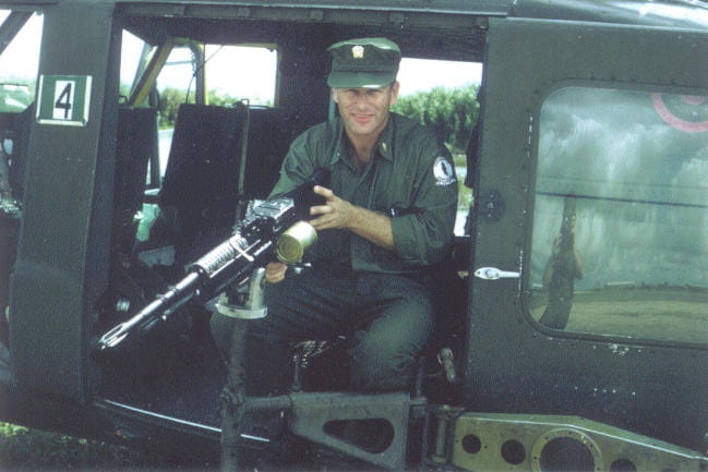 Bristow poses in a helicopter during a tour of duty in Vietnam.