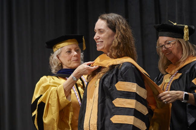 Nicole Sartor receives her sash at the MUSC College of Nursing 2022 convocation