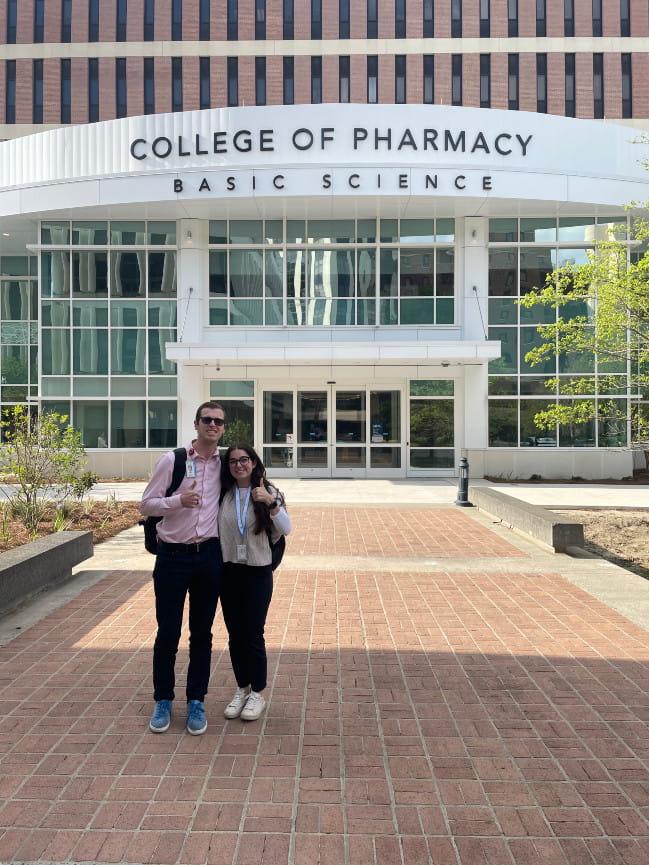 Skylar and Luke in front of the new College of Pharmacy building
