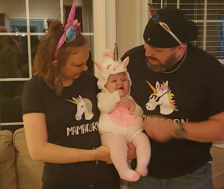 Bethany and husband Joshua hold baby Elaine
