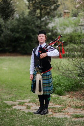 Alston Lewis in his bagpiping uniform.