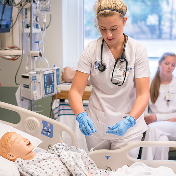 MUSC Nursing student practicing on a simulation